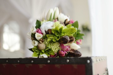 Beautiful wedding colorful bouquet for bride. Beauty of colored flowers. Close-up bunch of florets. Bridal accessories. Female decoration for girl. Details for marriage and for married couple