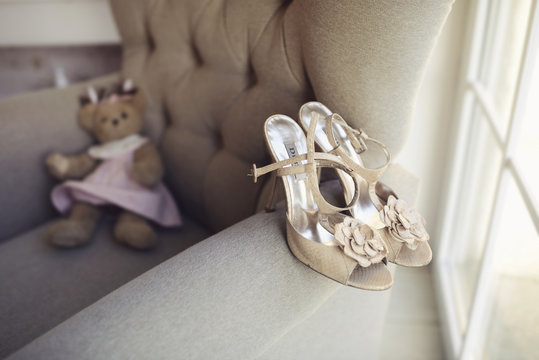 Beautiful colorful wedding shoes for bride indoors. Beauty of bridal heel for marriage. Female couple boots for celebration