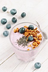 Overnight chia seeds and blueberry yogurt with homemade granola.Healthy eating concept.Selective focus