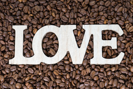Fototapeta Coffee beans / Coffee beans and wooden letters with the word love