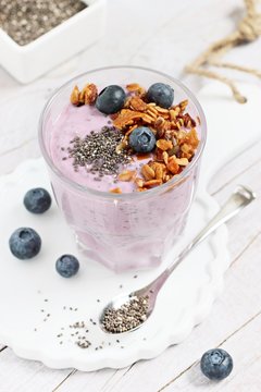 Overnight chia seeds and blueberry yogurt with homemade granola.Healthy eating concept.Selective focus