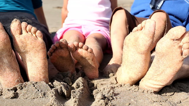 Feet in the sand, closeup