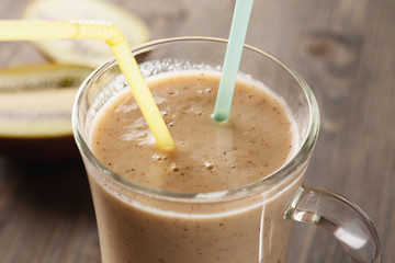 Fruit smoothie with straws closeup shot
