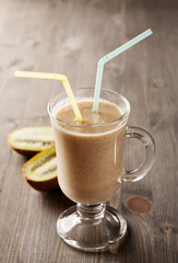 Fruit cocktail with two straws in it