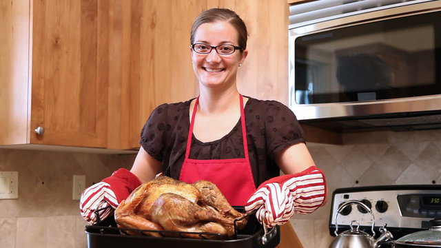 Woman holding Thanksgiving turkey