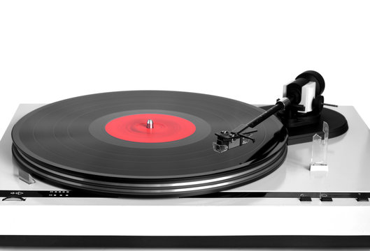 Modern turntable in silver case with rotation vinyl record with red label isolated on white background. Horizontal photo front view closeup