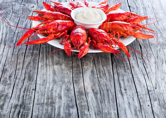 Boiled red crayfish, on an old wooden table