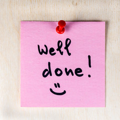 Well done note on paper post it pinned to a wooden board