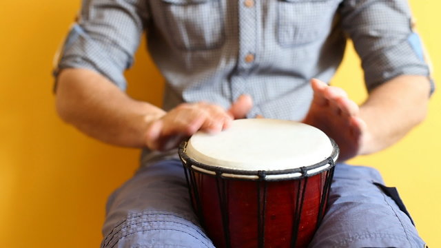 Playing Bongo drum close up HD stock footage. Hand tapping a Bongo drum in close up. 