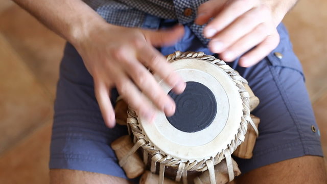 Playing Bongo drum close up HD stock footage. Hand tapping a Bongo drum in close up. 