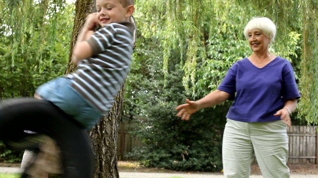 Senior woman playing with grandchildren