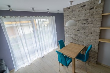 dining room with old grey brick wall