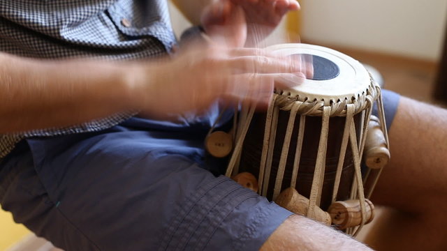 Playing Bongo drum close up HD stock footage. Hand tapping a Bongo drum in close up. 
