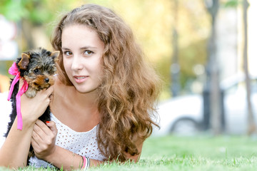 woman beautiful young happy with long hair holding small dog on