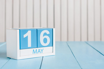 May 16th. Image of may 16 wooden color calendar on white background.  Spring day, empty space for text.  Biographers Day