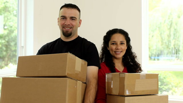 couple in new home with boxes