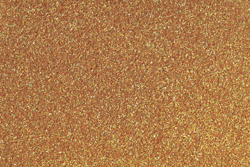 Golden glitter texture. Low contrast photo.