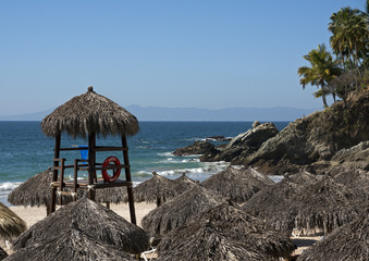 Beach palapas and guard tower