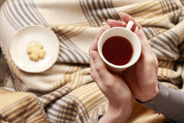 Woman holding a cup of tea