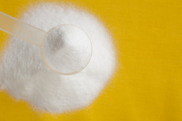 Selective focus of creatine monohydrate powder in measure spoon