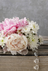 Floral arrangement with pink peonies, white chrysanthemums