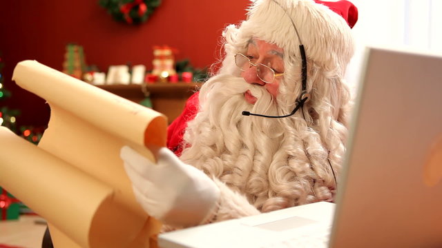 Santa Claus talking on headset