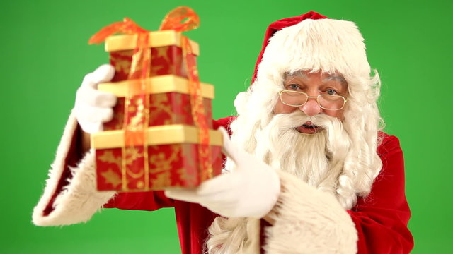 Santa Claus holding up Christmas gift