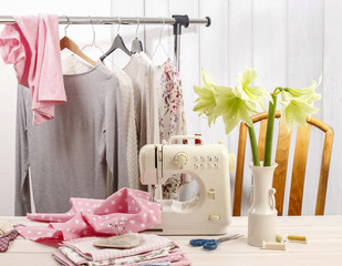 Sewing machine, clothes ready to wear and colorful fabrics