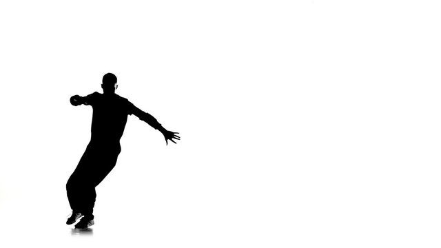Dancer man dancing breakdance on white, silhouette, slow motion