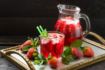 Refreshing drink with strawberries and ice