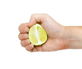 lime in hand isolated on white background