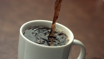 Coffee pouring, slow motion - Powered by Adobe