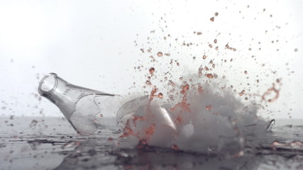 Chemistry beaker falling and breaking, slow motion