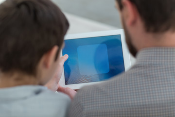 Cute friendly family is entertaining with modern technology