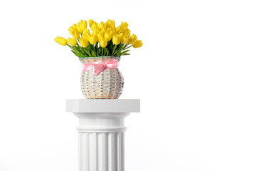 Vase with tulips. / Vase with a bouquet of tulips standing on the Ionic column.