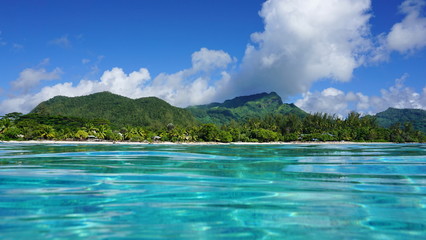 Coastal landscape near the village of Fare of Huahine island, seen from the water surface in the lagoon, Pacific ocean, French Polynesia © dam