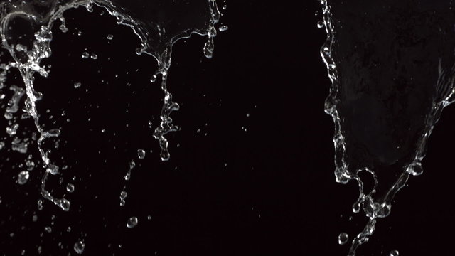Water on black background, slow motion