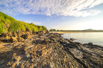 Fototapeta na wymiar Texture of beach rock with nature sunlight