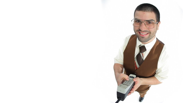 Nerdy guy texting with old phone