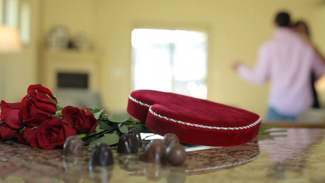 Chocolates and roses with couple dancing