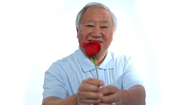 Senior man with rose