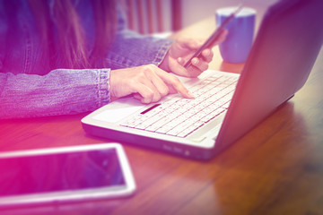 Woman using smartphone and notebook computer, technology concept and ideas