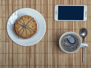 Morning cap of coffee with cookies