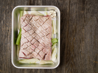 rustic raw uncooked seasoned pork belly