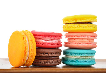 colorful macarons on wooden tray