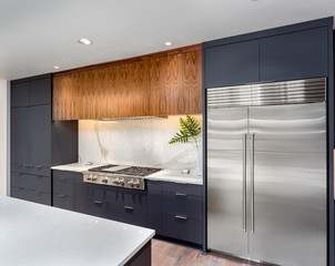 Elegant Kitchen Interior Detail in New Luxury Home :Cabinets with Island, Stainless Steel...
