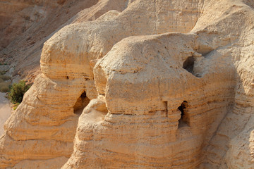 Qumran caves at the archaeological site in the Judean desert of the West Bank, Israel.