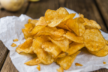 Portion of crispy Potato Chips (selective focus)