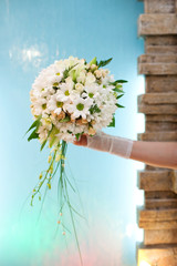 Beautiful wedding bouquet of flowers in bride's hand