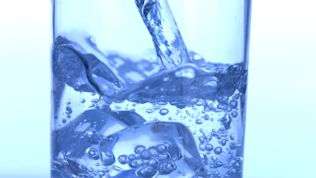 Pouring glass of water, slow motion
